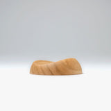 A pen rest that enhances the moments between writing. Designed to hold any pen without the need for precise placement, it blends effortlessly into your desk space with a subtle but assured presence. Enjoy the rich texture and wood grain of Japanese cherry.

Designed for stability to ensure your pens and surfaces are protected from accidental movement or damage. The pen rest comfortably holds two to three slender pens.

Use and Care:

To prevent distortion and discolouration, avoid soaking in water, sudden t