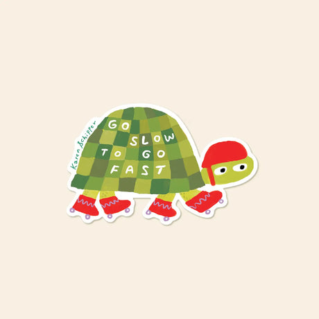 Karen Schipper Vinyl Sticker - Roller Skate Turtle

Playful, quirky, and full of charm, Rollerskate Turtle Sticker features a green checkered turtle in bright red roller skates and helmet with the encouraging phrase “Go Slow to Go Fast” across its shell. The bold colors and whimsical movement make this design an easy standout in sticker racks, giftable assortments, and feel-good displays.

Made from matte-coated, waterproof vinyl, it’s durable enough for laptops, planners, water bottles, and more. It’s an e