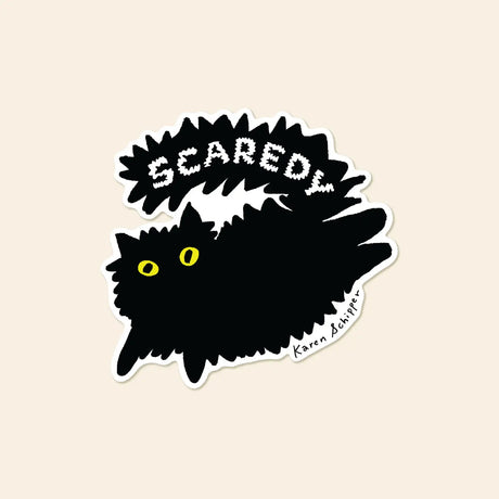 Karen Schipper Vinyl Sticker - Scaredy Cat

Bold, quirky, and full of personality, Scaredy Cat Sticker features a fluffy black cat with bright yellow eyes and an arched back beneath the word “Scaredy.” The graphic black-and-white design gives it strong shelf appeal and makes it an easy standout in cat, humor, and Halloween-themed assortments.

Made from matte-coated, waterproof vinyl, it’s durable enough for laptops, planners, water bottles, and more. It’s an easy impulse add-on for cat people, best friends