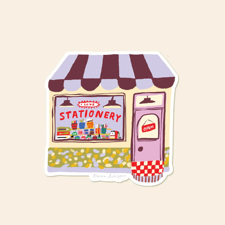 Karen Schipper Vinyl Sticker - Stationery Store

A tiny storefront made for paper lovers, Stationery Store Sticker features a charming shop with a striped awning, pink door, colorful window display, and the phrase “I love stationery.”

Made from matte-coated, waterproof vinyl, it’s durable enough for laptops, planners, water bottles, and more. It’s an easy impulse add-on for cat people, best friends, and shoppers looking for a small but meaningful gift.

Measures approximately 3 inches
Matte coating; durabl