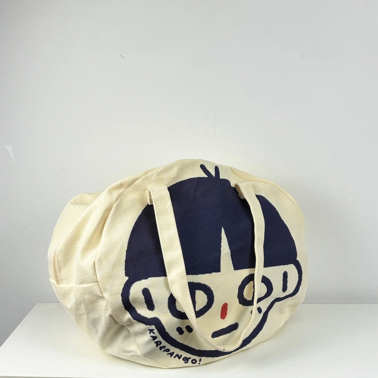 Karepango Haya: Large Zipper Tote Bag

Our signature tote bag with a signature face. Stand out with true character. Zipper closure on top.