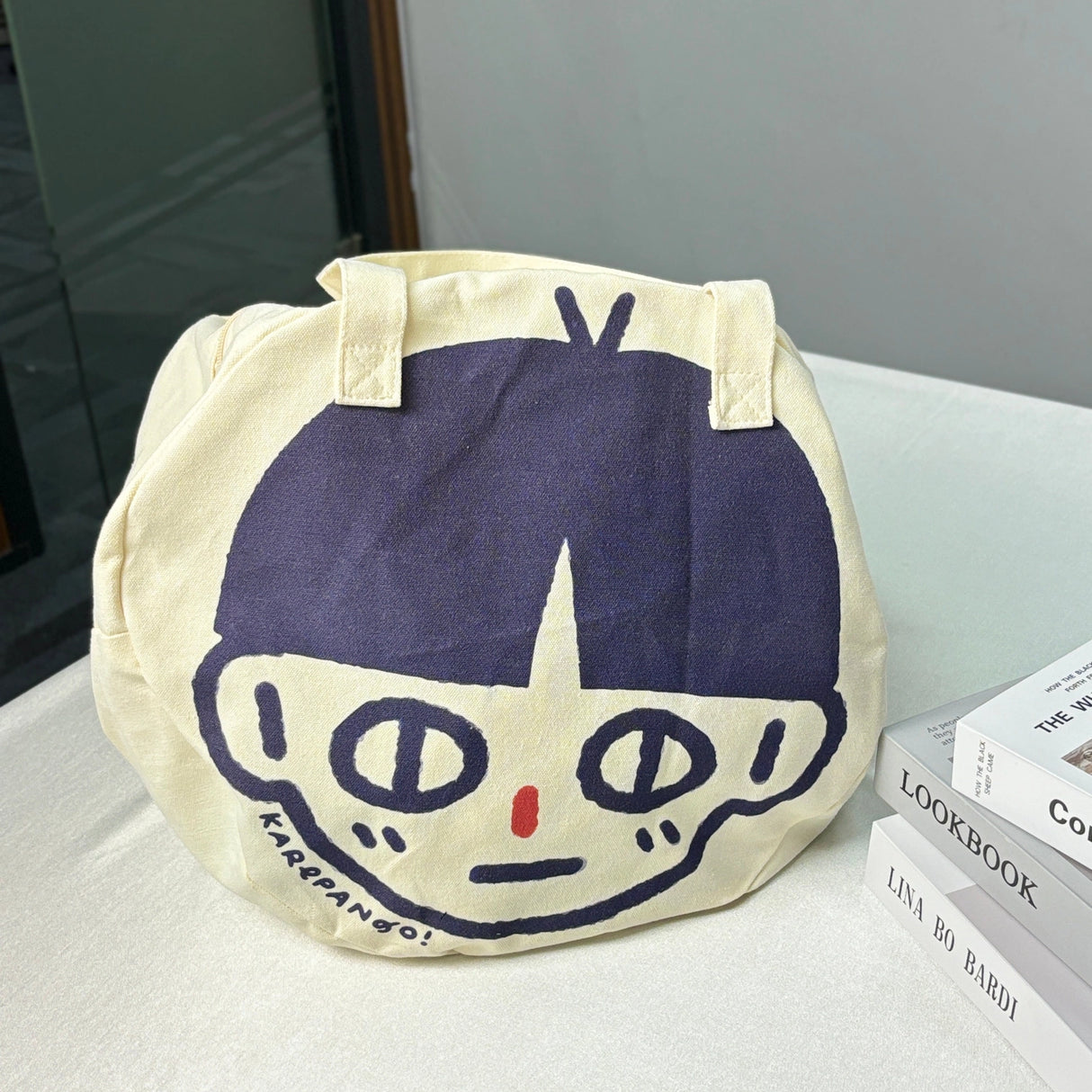 Karepango Haya: Large Zipper Tote Bag

Our signature tote bag with a signature face. Stand out with true character. Zipper closure on top.