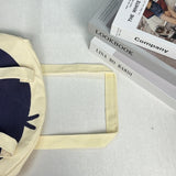 Karepango Haya: Large Zipper Tote Bag

Our signature tote bag with a signature face. Stand out with true character. Zipper closure on top.