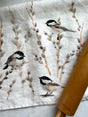 Introducing a gorgeous watercolor pattern of black capped chickadees and fuzzy spring willows that will add a touch of elegance and serenity to your home. Bringing a sweet whisper of the outdoors into your kitchen.

Crafted from 100% premium linen, this towel measures 17.5 x 26 inches, blending beauty with utility. Each comes with a belly band, perfect for gifting and a corner hang loop for hanging.

Designed by Kasey. Imported.

Artwork copyright Kasey Melissa Art 2024.