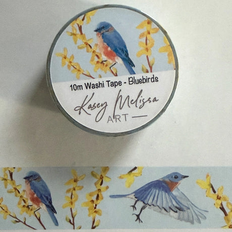 Bluebird and forsythia flower washi tape. Add a bit of color to your journal, letters or scrapbooking.&nbsp;

- 1 inch wide
- 10 Meters long
- designed by Kasey

Images and art copyright Kasey Melissa Art