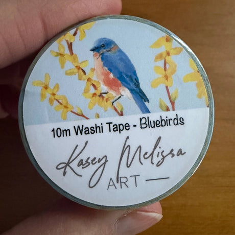 Bluebird and forsythia flower washi tape. Add a bit of color to your journal, letters or scrapbooking.&nbsp;

- 1 inch wide
- 10 Meters long
- designed by Kasey

Images and art copyright Kasey Melissa Art