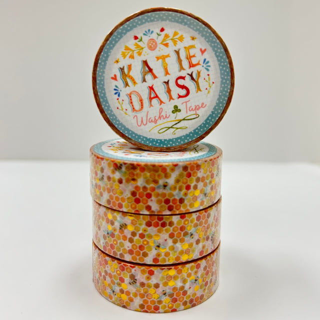 Katie Daisy - Gold Foil Honeycomb Washi Tape

There are so many uses for washi tape! You can use it for scrapbooking, gift wrapping, and even home decor projects :) Add some extra charm to your letter-writing, use it to tack up photos... the possibilities are endless!

Details:

* Traditional washi tape, printed on rice paper
* Each roll is 15mm wide, 10m long, and the pattern reprints every 350mm.
* Semi-transparent&nbsp;