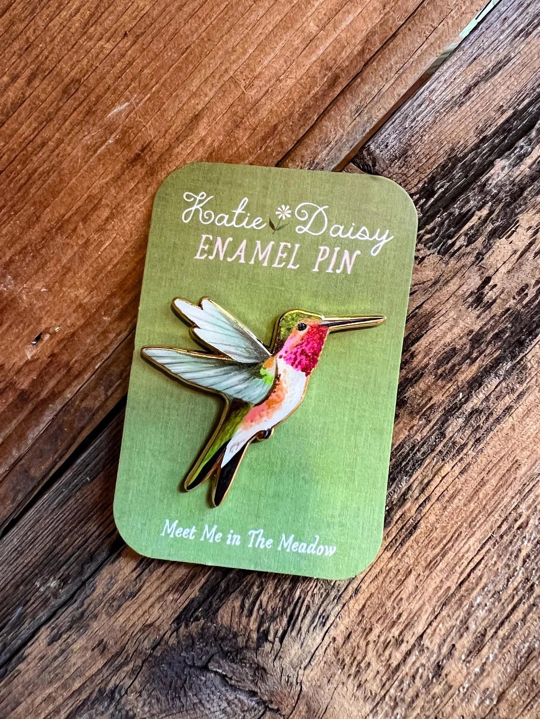 Hummingbird Enamel Pin by Katie Daisy

A tiny treasure to pin on your jacket, tote, or favorite old flannel—each one a little love letter to country delights, small joys, and the art of noticing.