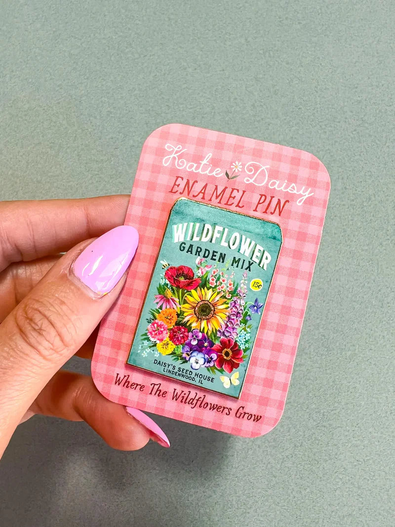 Seed Packet Enamel Pin by Katie Daisy

A tiny treasure to pin on your jacket, tote, or favorite old flannel—each one a little love letter to country delights, small joys, and the art of noticing.