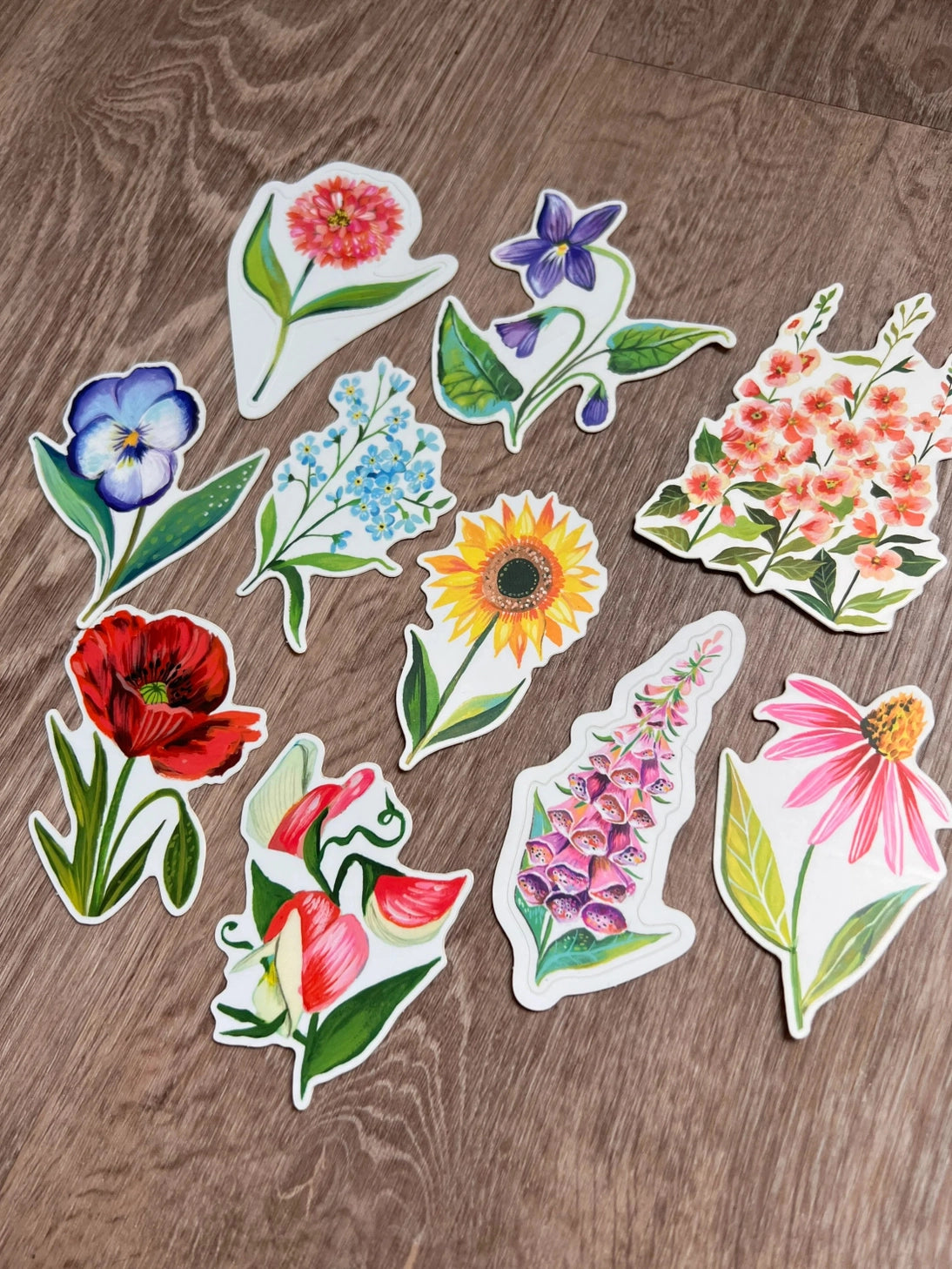 Wildflower Sticker Pack - Set of 10 Matte Stickers by Katie Daisy

From The Garden of Katie Daisy:

Adorn your laptop, water bottle, packages and so much more with this set of vibrant wildflower STICKERS!! You'll receive 10 floral stickers in a seed packet! (This listing is not for wildflower seeds ;) )