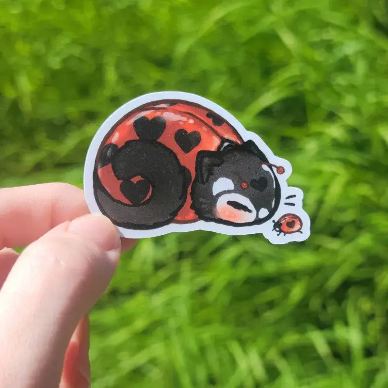 Katrina Wold Art - Tiny Cat Vinyl Sticker - Summer Ladybug

2.25" matte vinyl sticker featuring a sleepy ladybug kitty with a little ladybug friend.

Matte laminated vinyl sticker
Waterproof, UV- and scratch-resistant
Features original, 100% hand-drawn art
Actual color may vary due to differences in lighting, device screen settings, etc.