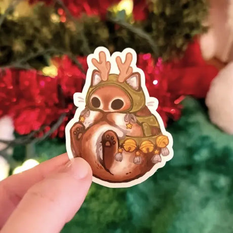 Katrina Wold Art - Tiny Cat Vinyl Sticker - Winter Reindeer

2.47" matte laminated vinyl sticker featuring a cute kitty dressed up as a reindeer.

Matte laminated vinyl sticker
Waterproof, UV- and scratch-resistant
Features original, 100% hand-drawn art
Actual color may vary due to differences in lighting, device screen settings, etc.