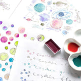 The colors of these Gansai watercolors separate to create whimsical and dreamy effects.

The degree of color separation and blurring may vary depending on the type of paper used. You can enjoy greater changes in color by dissolving the watercolors in lots of water and letting the colors separate on your palette before painting.