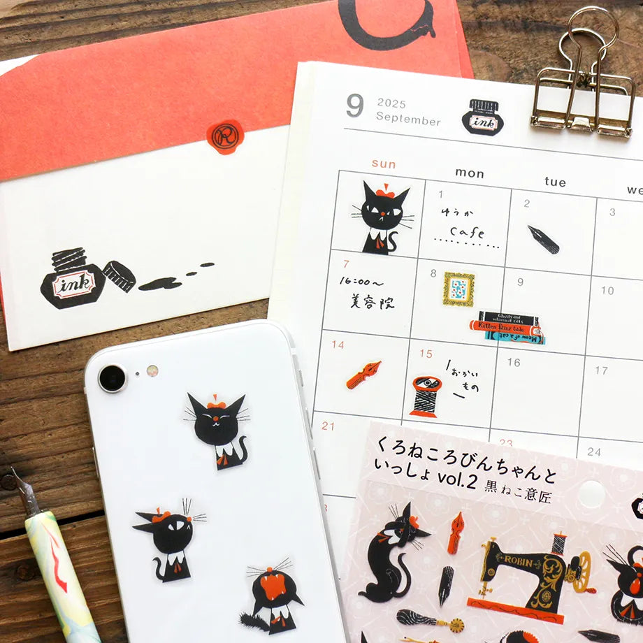 A sticker featuring a stylish black cat named 'Robin-chan' as the main character.
Robin-chan's pose, which gives off the unique softness of cats, is irresistibly cute.
The sewing machine, sewing kit, pen nibs, ink, sealing stamps, and other stylish items lined up are also stylish.


Printed on PET material, the stickers have a smooth, durable finish that’s easy to peel and place - great for both everyday use and special projects.

✨ Product Details

Smooth, durable PET sticker material
Perfect for planners,