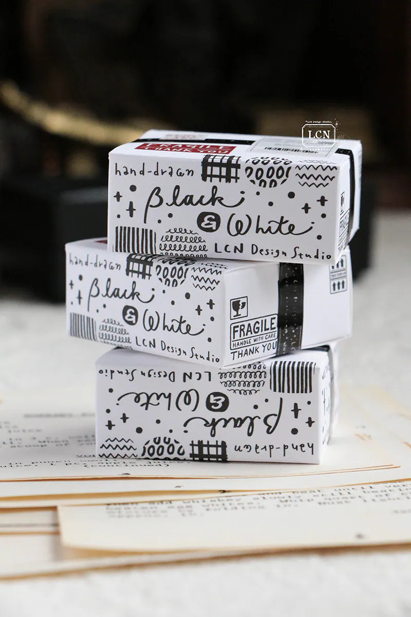 A mini package box full of black and white stickers!
How cute is that!
It has everything: a fragile sticker, shipping label, and even an invoice!
That invoice is also a sticker!