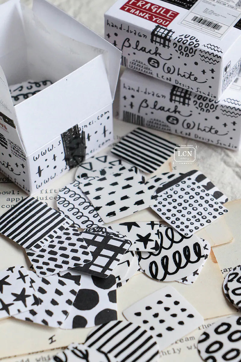 A mini package box full of black and white stickers!
How cute is that!
It has everything: a fragile sticker, shipping label, and even an invoice!
That invoice is also a sticker!