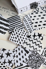 A mini package box full of black and white stickers!
How cute is that!
It has everything: a fragile sticker, shipping label, and even an invoice!
That invoice is also a sticker!