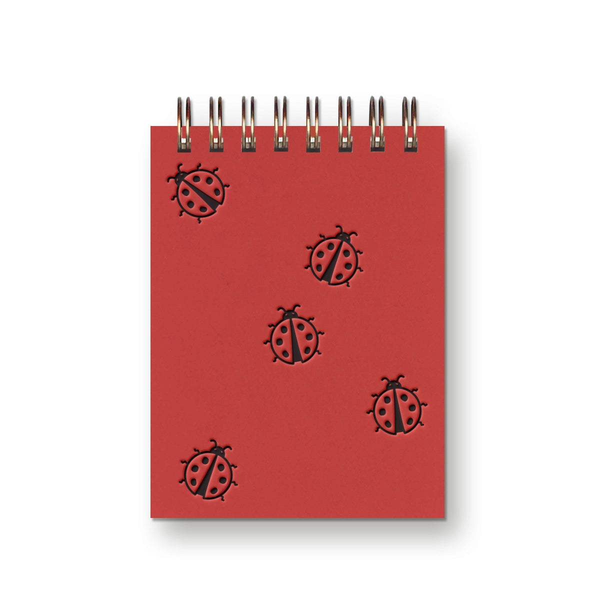 Our Ladybug Mini Notebook is a petite and charming pocket-sized companion that brings a touch of nature's whimsy to your everyday notes. Whether you're jotting down quick thoughts, making lists, or simply enjoying a moment of reflection, this mini notebook is a perfect canvas for your loftiest ideas.

Additional Details :

3”x4"
65 Unlined Interior Pages
Uncoated Vellum 70# Text Off-White Interior Paper
Bronze Wire-O Binding
Locally Made in Lawrence, Kansas
