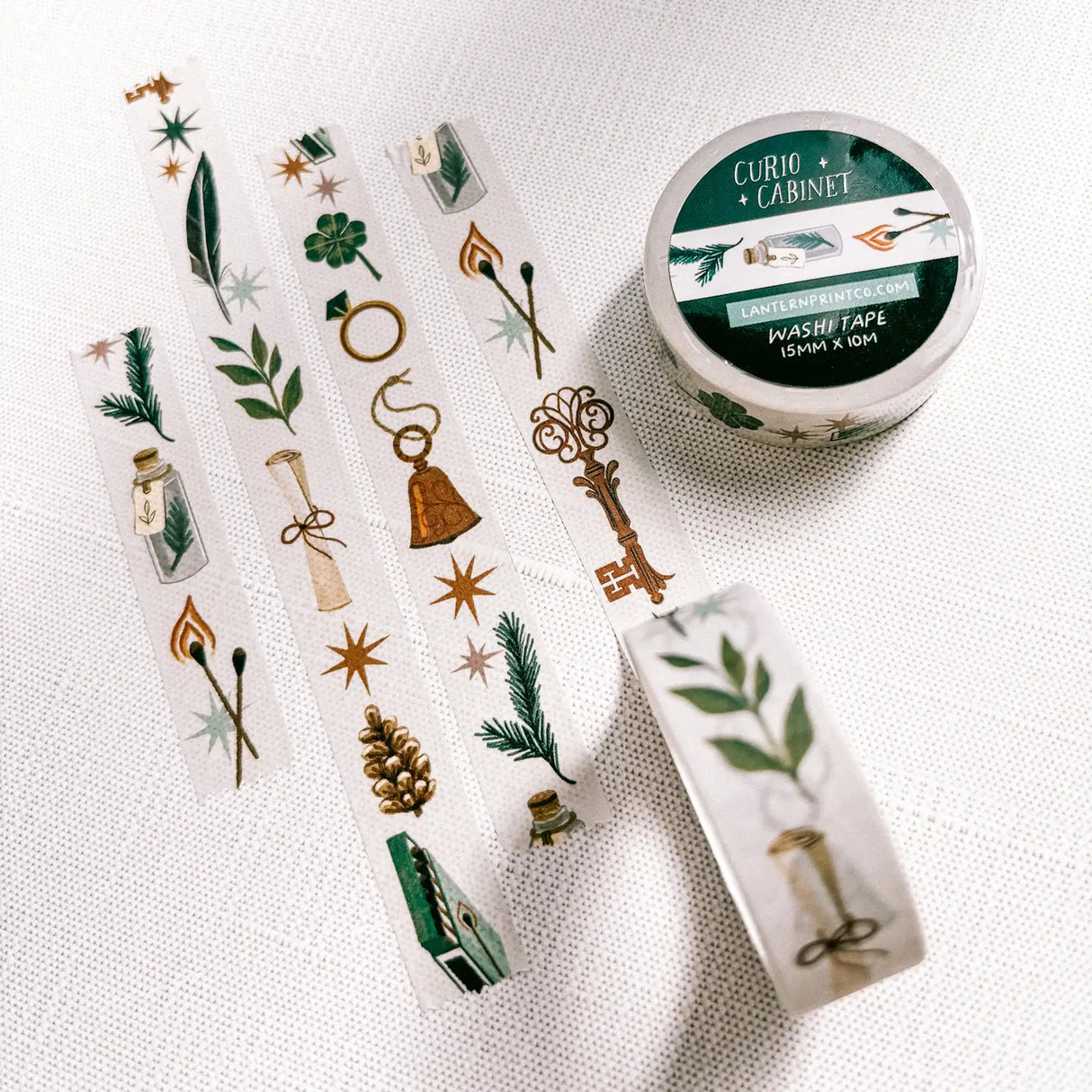 Removable Washi craft tape for journaling and gift wrapping; featuring curios, specimens, and trinkets on an off-white background.

15mm x 10m
Shrink wrap packaging with label