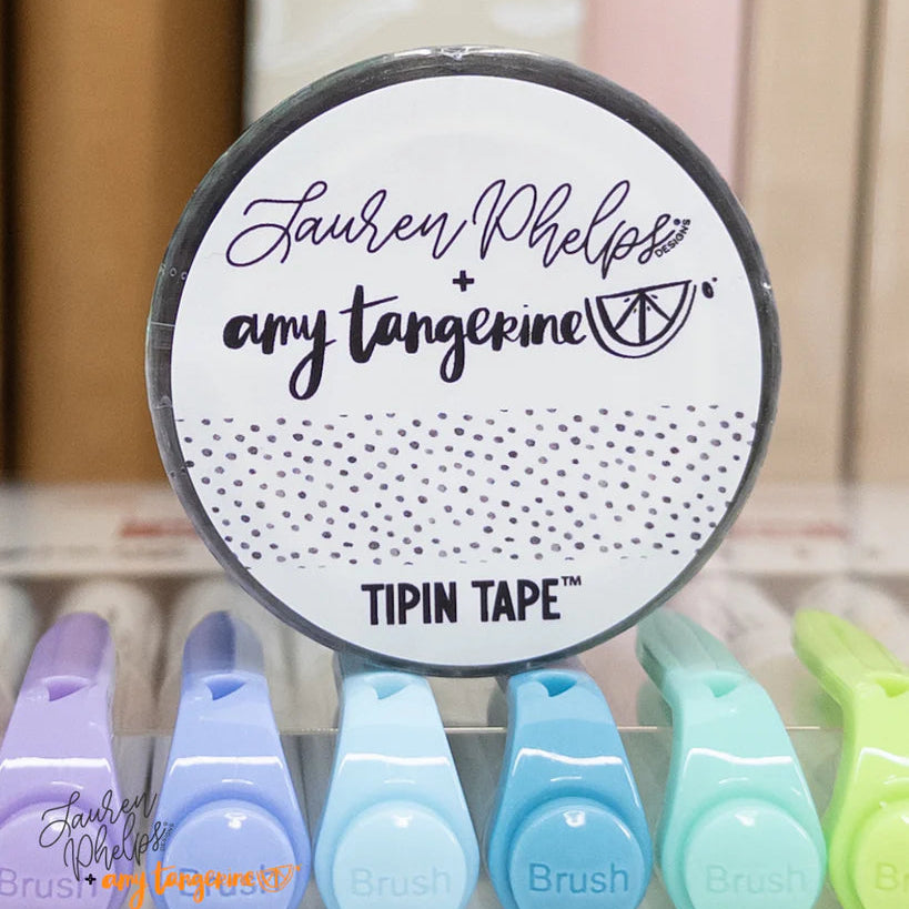 Do you love adding interactive elements to your scrapbook layouts like photos, journaling cards, patterned paper, ephemera, and keepsakes, but want a clean, professional way to attach them without bulky adhesives or visible hinges?

Tip In Tape™ was designed for exactly that.

Tip In Tape™ is a clear matte PET tape created for adding interactive elements to scrapbook pages and paper crafting projects with precision and ease. It allows you to create flip-ups, tip-ins, layered details, and movable elements wh