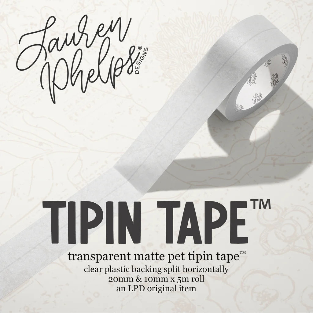 Do you love adding interactive elements to your scrapbook layouts like photos, journaling cards, patterned paper, ephemera, and keepsakes, but want a clean, professional way to attach them without bulky adhesives or visible hinges?

Tip In Tape™ was designed for exactly that.

Tip In Tape™ is a clear matte PET tape created for adding interactive elements to scrapbook pages and paper crafting projects with precision and ease. It allows you to create flip-ups, tip-ins, layered details, and movable elements wh