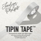 Do you love adding interactive elements to your scrapbook layouts like photos, journaling cards, patterned paper, ephemera, and keepsakes, but want a clean, professional way to attach them without bulky adhesives or visible hinges?

Tip In Tape™ was designed for exactly that.

Tip In Tape™ is a clear matte PET tape created for adding interactive elements to scrapbook pages and paper crafting projects with precision and ease. It allows you to create flip-ups, tip-ins, layered details, and movable elements wh