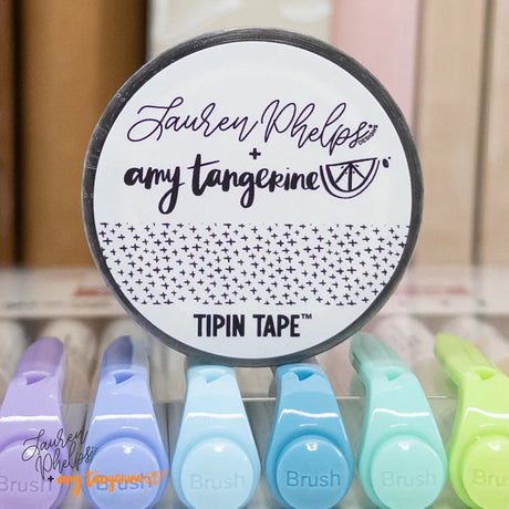 Do you love adding interactive elements to your scrapbook layouts like photos, journaling cards, patterned paper, ephemera, and keepsakes, but want a clean, professional way to attach them without bulky adhesives or visible hinges?

Tip In Tape™ was designed for exactly that.

Tip In Tape™ is a clear matte PET tape created for adding interactive elements to scrapbook pages and paper crafting projects with precision and ease. It allows you to create flip-ups, tip-ins, layered details, and movable elements wh