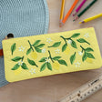 Keep your favorite notebooks and writing accessories together forever with our new notebook pouches. (Seriously, we're not sure why we didn't think of these sooner.) Embroidered design on soft faux suede, fully lined with an elastic band that fits around most notebooks.

Vegan Leather Pouch with Zipper
Elastic Fits Books up to 9" High
Zipper closure
6.5" x 2"