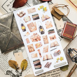 📜🕯️ A stack of letters waits to be opened in @jeannadano’s vintage-inspired stationery set. Weathered envelopes, handwritten notes, and well-loved books, all gathered together as if for a quiet evening of reading and reflection. With delicate paper textures and warm, timeworn tones, this charming set captures the feeling of sunlight on antique paper. Art by: @jeannadano

Top Coating: None
Adhesive Layer: Paper
Backing Layer: Paper
6.69" x 3.54".
Weight - 0.03lbs.
1 sheet included &nbsp; &nbsp;