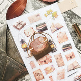 📜🕯️ A stack of letters waits to be opened in @jeannadano’s vintage-inspired stationery set. Weathered envelopes, handwritten notes, and well-loved books, all gathered together as if for a quiet evening of reading and reflection. With delicate paper textures and warm, timeworn tones, this charming set captures the feeling of sunlight on antique paper. Art by: @jeannadano

Top Coating: None
Adhesive Layer: Paper
Backing Layer: Paper
6.69" x 3.54".
Weight - 0.03lbs.
1 sheet included &nbsp; &nbsp;