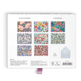 Elevate your correspondence with the Liberty Premium Notecard Set. This elegant collection features 16 folded notecards showcasing 8 distinctive iconic Liberty London designs. Each card is finished with delicate die-cut scalloped edges that add a refined touch to every note you send. The set includes full-color envelopes lined with charming floral patterns, bringing beauty to every detail. Presented in a premium drawer box with a sturdy ribbon pull, this notecard set makes a sophisticated gift or a treasure