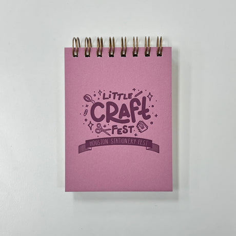 Little Craft Fest Mini Jotter Notebook - Pink

Introducing our new Little Craft Fest Mini Jotter Notebook! This petite and charming pocket-sized companion brings a touch of Little Craft Fest to your everyday notes. Whether you're jotting down quick thoughts, making lists, or simply enjoying a moment of reflection, this mini notebook is a perfect canvas for your loftiest ideas.&nbsp;

Additional Details :

3”x4"
65 Unlined Interior Pages
Uncoated Vellum 70# Text Off-White Interior Paper
Bronze Wire-O Binding