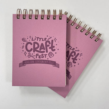 Little Craft Fest Mini Jotter Notebook - Pink

Introducing our new Little Craft Fest Mini Jotter Notebook! This petite and charming pocket-sized companion brings a touch of Little Craft Fest to your everyday notes. Whether you're jotting down quick thoughts, making lists, or simply enjoying a moment of reflection, this mini notebook is a perfect canvas for your loftiest ideas.&nbsp;

Additional Details :

3”x4"
65 Unlined Interior Pages
Uncoated Vellum 70# Text Off-White Interior Paper
Bronze Wire-O Binding
