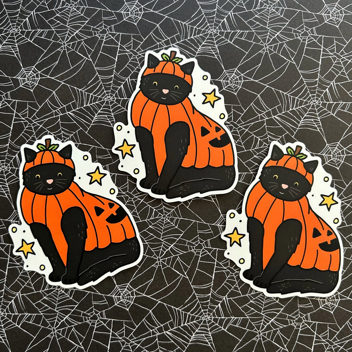 Little Spooky Studio - Beanie Pumpkin Cat Vinyl Sticker

A black cat wearing a pumpkin costume :)