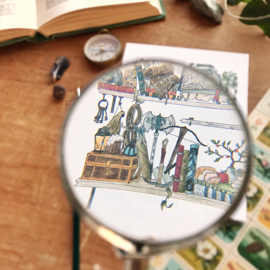 Postcard featuring my original watercolor and ink illustration of the oddities and books tucked away in the shelves of an intrepid adventurer, including a tiny dragon and a rather talkative raven.

• Printed on high quality card stock
• Each postcard measures 4.25 x 5.5" (A2)
