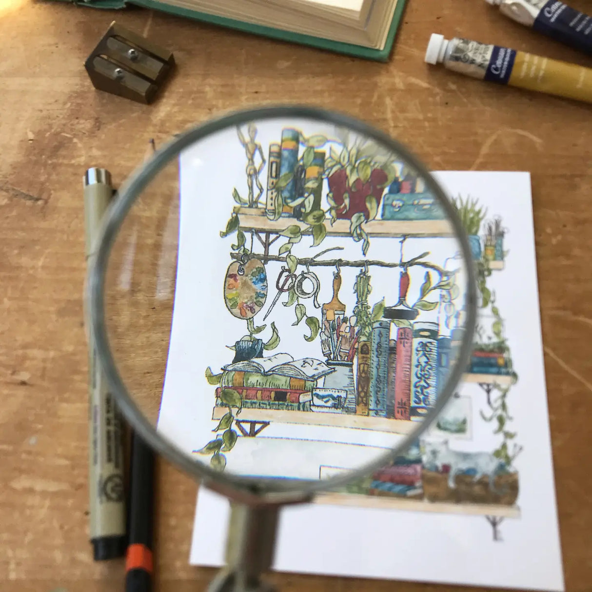 Postcard featuring my original watercolor and ink illustration of the oddities and books tucked away in the shelves of an artist.

• Printed on high quality card stock
• Each postcard measures 4.25 x 5.5" (A2)