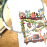Postcard featuring my original watercolor and ink illustration of the magical foxes and delightfully whimsical holiday items arranged on the shelves of a Christmas witch, including a tiny mouse reading a book, beautifully wrapped presents, and portraits of the witch's friends.

• Printed on high quality card stock
• Each postcard measures 4.25 x 5.5" (A2)