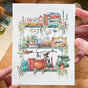 Postcard featuring my original watercolor and ink illustration of the oddities, books, tools, and trinkets tucked away in the shelves of a swamp witch, including an assortment of creatures brewing up a potion, and an alligator skull holding a crystal ball.