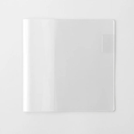 A transparent cover that fits snugly around your MD Notebook

This is a special cover that gently wraps your MD Notebook. The transparent cover protects the notebook from dirt without ruining its appearance.
It subtly protects your notebook from water and dirt without interfering with its characteristics. If you put the cover on with the glassine paper still wrapped around it, the inorganic feel of the vinyl will be softened.
Because it is transparent, you can enjoy the cover design, illustrations, and writ