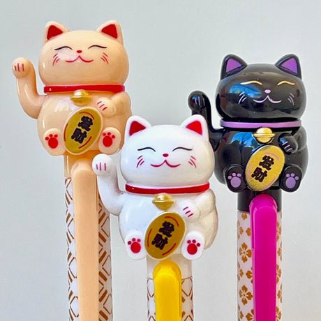 Bring a little good luck and a lot of cuteness to your writing routine with these pens! Each click makes the cat’s tiny paw&nbsp;move, adding a playful surprise every time you write. Smooth black gel ink and an adorable design make this pen a must‑have for stationery lovers and cat fans alike.

• Black Ink
• Writes very smoothly
• Measures approx. 6" - 7"
• Includes 1 pen, we will send one random color/design