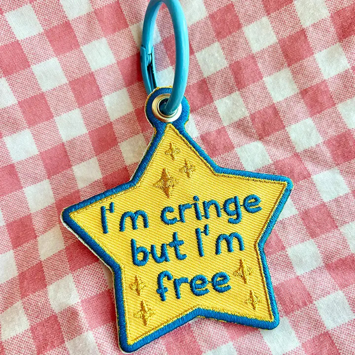 These cute embroidered keychains attach with a colorful ring clasp and are perfect for attaching to your keys or bag to bring with you on all of your adventures!

This star shaped keychain shows the world you may be cringe, but at least you're free! No shame here!

Includes one keychain only.
Embroidered on both sides. The design is the same on both sides.
Materials: Cotton, Polyester, Brass