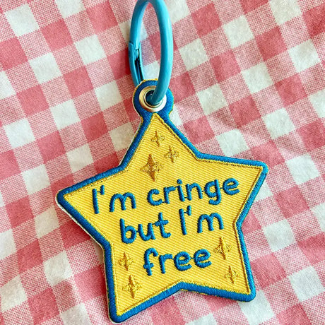 These cute embroidered keychains attach with a colorful ring clasp and are perfect for attaching to your keys or bag to bring with you on all of your adventures!

This star shaped keychain shows the world you may be cringe, but at least you're free! No shame here!

Includes one keychain only.
Embroidered on both sides. The design is the same on both sides.
Materials: Cotton, Polyester, Brass