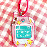 These cute embroidered keychains attach with a colorful ring clasp and are perfect for attaching to your keys or bag to bring with you on all of your adventures! This design features extra grommets to hang more keychains and knick knacks!

Includes one keychain only.
Embroidered on both sides. The design is the same on both sides.
Materials: Cotton, Polyester, Brass