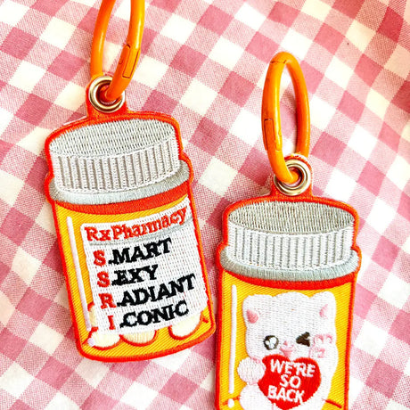 These cute embroidered keychains attach with a colorful ring clasp and are perfect for attaching to your keys or bag to bring with you on all of your adventures! This design features extra grommets to hang more keychains and knick knacks!

Includes one keychain only.
Embroidered on both sides. The keychain is double sided with different artwork on each side as pictured.
Materials: Cotton, Polyester, Brass