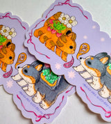 A Kitten and Puppy Bus sticker!

This vinyl matte sticker is weather and waterproof-stick it on a notebook, bike, or car- it's going to stick around! Heck, throw it on a water bottle and through the dishwasher. This sticker can go anywhere. Sticker measures 3" x 5" Printed in USA.
