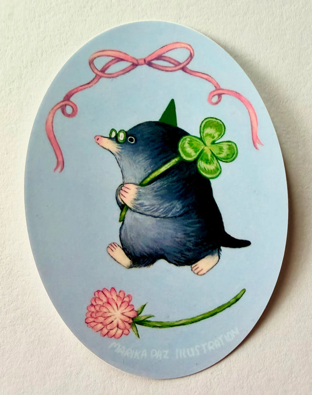 A very lucky mole takes their four-leaf clover home.

This vinyl matte sticker is weather and waterproof-stick it on a notebook, bike, or car- it's going to stick around! Heck, throw it on a water bottle and through the dishwasher. This sticker can go anywhere. Sticker measures 3.25" x 4.5" Printed in USA.