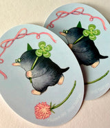 A very lucky mole takes their four-leaf clover home.

This vinyl matte sticker is weather and waterproof-stick it on a notebook, bike, or car- it's going to stick around! Heck, throw it on a water bottle and through the dishwasher. This sticker can go anywhere. Sticker measures 3.25" x 4.5" Printed in USA.