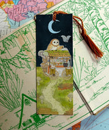 Acorn Market is open for business. Day or night, Owl will be attending its customers.

Bookmarks are double sided with different art of the market open in day and night on each side.

Printed on heavy cardstock and comes with a tassel, these bookmarks measure 2x6 inches.&nbsp;

Printed in USA