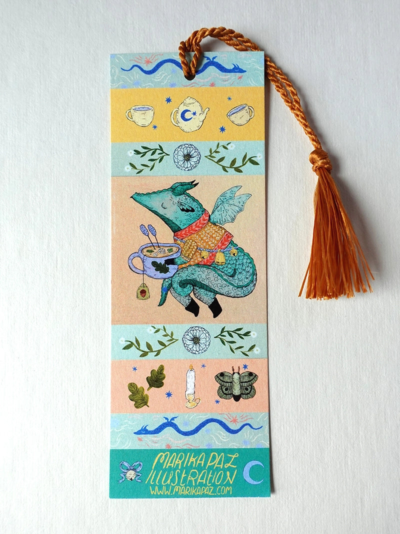 A dragon on an adventure! This dragon is great at keeping your place in your favorite book. Perfect for book lovers! This bookmark has the same image on both sides.

Printed on heavy cardstock and comes with a tassel, these bookmarks measure 2x6 inches.&nbsp;

Printed in USA