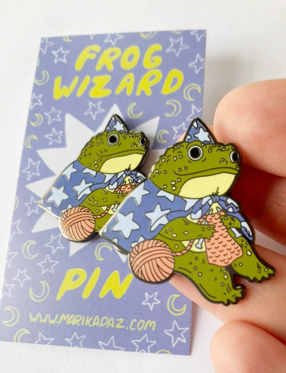 Marika Paz Illustration - Frog Wizard Enamel Pin

A Frog Wizard knits up some spells. This Frog Wizard is a hard enamel pin.

This pin measures approximately 1.50" and features a clasp for easy closure.

The metal outline color is black/gray